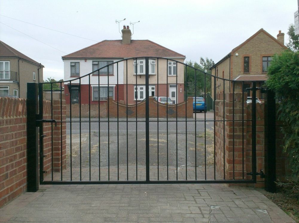 Black metal double driveway gates fitted by Ryan Fencing